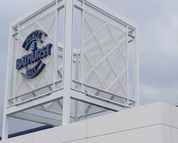 Place Bathurst Mall sign mounted within its white structural frame.
